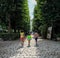 Children stroll along a cobbled path on the grounds of the Rodin museum