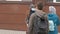 Children students in medical masks leave the school