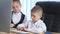 Children in suits working in office