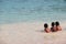Children swim happily together in the sea of Surin Island