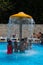 Children swim in the pool under the fountain. Donbass 03.07.2020