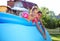 Children swimming in a inflatable swimming pool