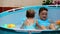 Children swimming in kid pool