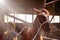 Children take care of the horse in the old  stable. Girl grooming horse with brush