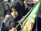 Children takes part in an Ashura ceremony