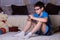 children, technology, internet communication and people concept - boy with smartphone texting message or playing game at home