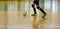 Children teen training soccer futsal indoor gym. Young boy with soccer ball training indoor football.
