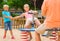 Children are teetering on the swing in the playground.