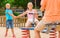 children are teetering on the swing in the playground.