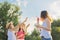 Children three girls playing with soap bubbles