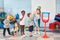 Children throw basketball into a net