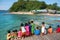 Children at timber pier look to the sea