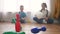 Children toddler a playing toy bowling on the floor. Happy family kindergarten kids dream concept. Children toddler play