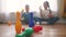 children toddler a playing toy bowling on the floor. happy family kindergarten kids dream concept. children toddler play