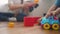 Children toddler a playing toy car on the floor. Happy family kindergarten kid dream concept. Children toddler play toys