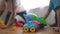 children toddler a playing toy car on the floor. happy family kindergarten kid dream concept. children toddler play toys