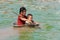 Children in the Tonle Sap lake in Cambodia