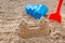 Children toys for build the sandcastle, Shovel, Molds laying on the sand at the seashore