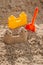 Children toys for build the sandcastle, Shovel, Molds laying on the sand at the seashore