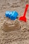 Children toys for build the sandcastle, Shovel, Molds laying on the sand at the seashore