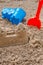 Children toys for build the sandcastle, Shovel, Molds laying on the sand at the seashore