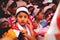 Children in traditional burmese dresses watching a new year celebration at Bilu Kyun, Ogre Island, Mon State, Myanmar