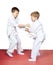 Children trained judo sparring on the mats