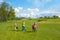 Children with trainer at golf