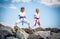 Children training karate on the stone coast