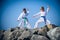 Children training karate on the stone coast