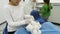 Children treat a toy with dentist using different dental tools. Close-up