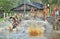 Children of the tribe of Asmat people bathe and swim in the river