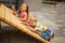 Children trying climbing the rope on playground