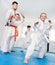 Children trying martial moves in karate class