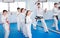 Children trying martial moves in karate class