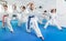 Children trying martial moves in karate class