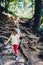 Children - twin girls are hiking in the mountains.