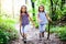 Children - twin girls are hiking in the mountains.