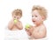 Children twins eating a green apple