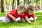 Children twins play on the grass