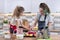 Children two girls sisters preparing muffins in home kitchen