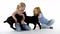 Children with two little black goatling at white background. Happy childhood concept. Studio video of kids emotion.