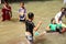 Children in the village play cheerful water slides on the river,