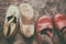 Children vintage shoes on old wood background. Childhood memory