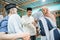 children visiting their parent and shake hand on idul fitri