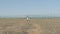 Children walk a dirt path circa in the refugee camp. concept Immigration crisis poor boy and his sister need of help