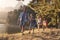 Children Walk By Lake With Parents On Family Hiking Adventure