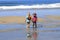 Children walking on beach