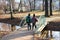 Children walking over bridge in park