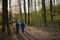 Children walking in a spring forest